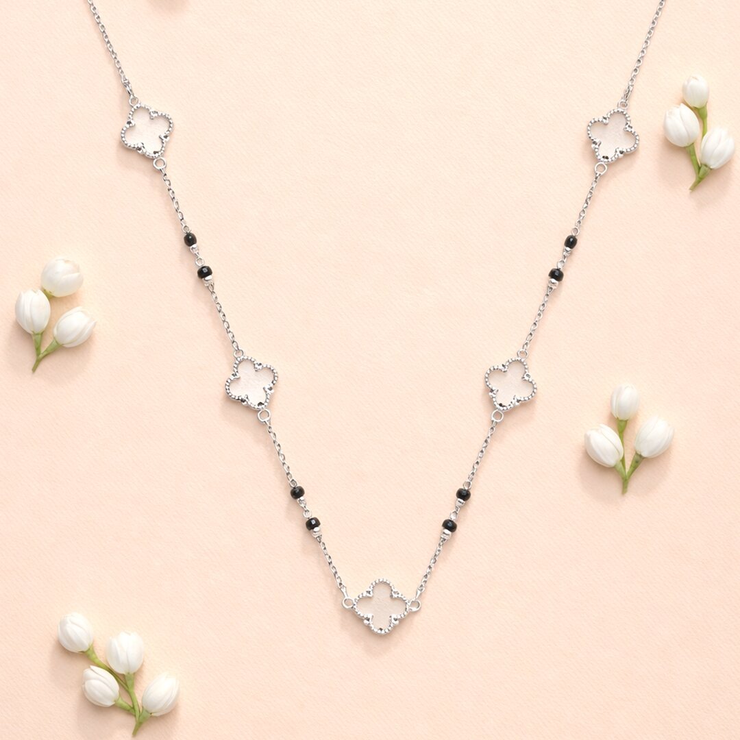 ANVI Silver flower charm necklace product shoot Nashik